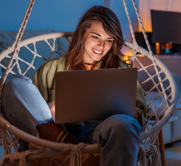 Woman uses a laptop